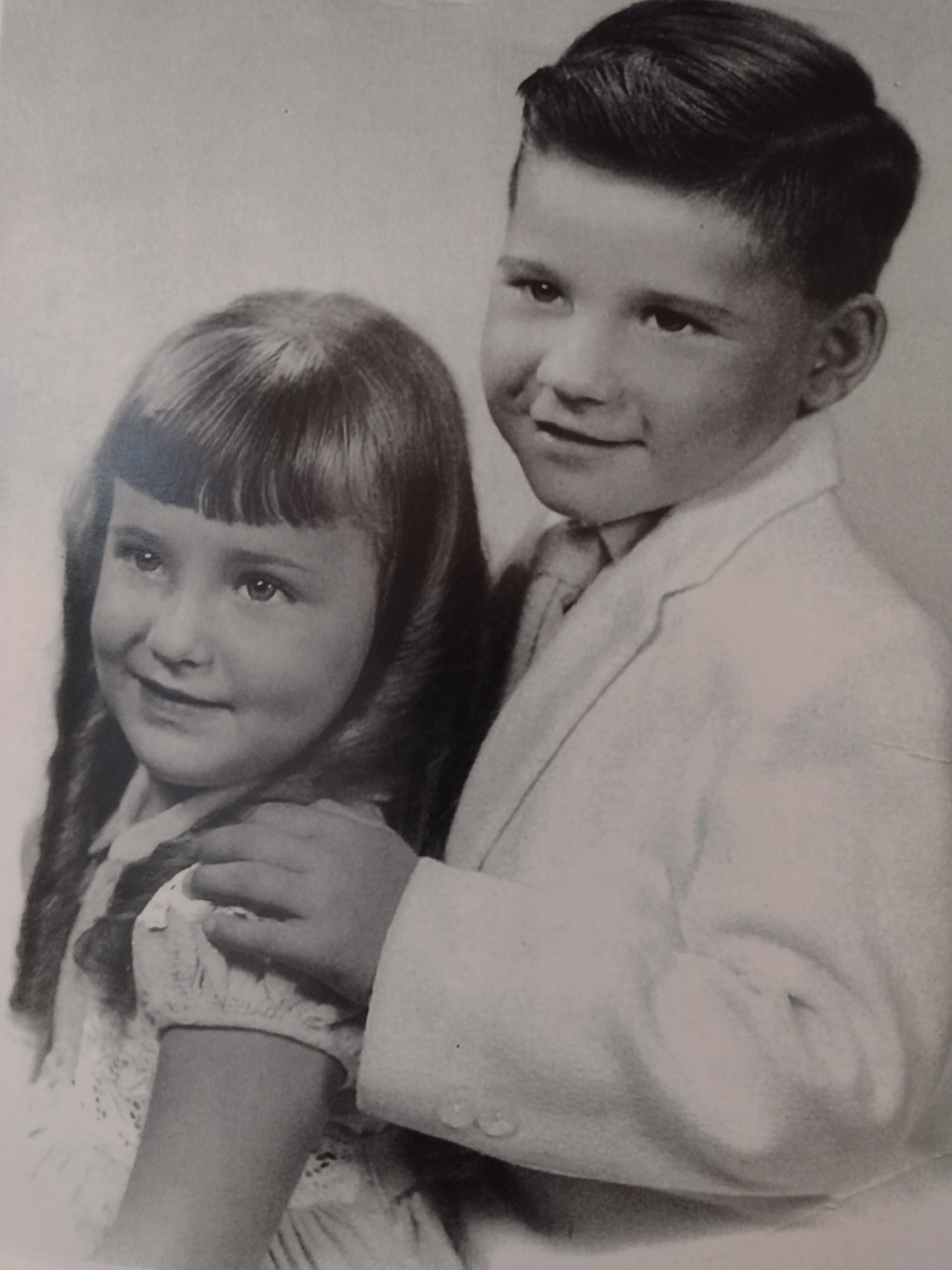 A childhood portrait of a young boy and girl