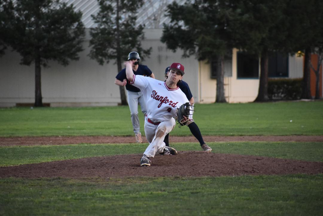 A boy pitching during a baseball game