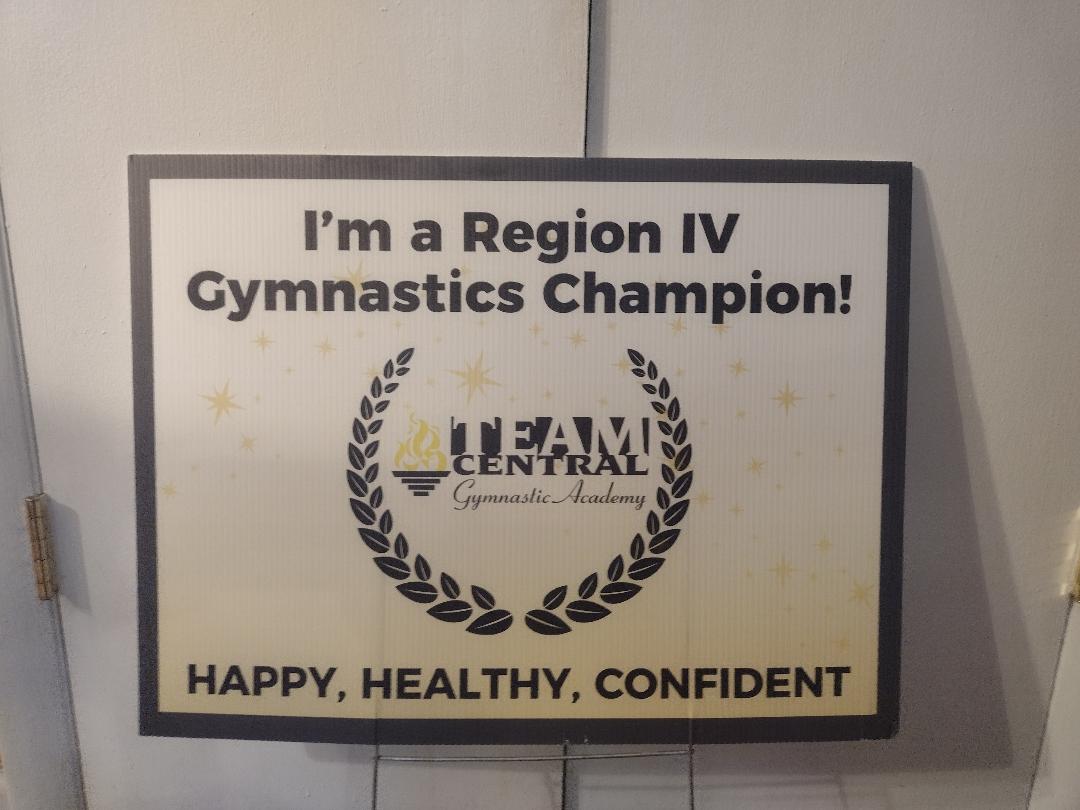 A Region IV gymnastics champion sign