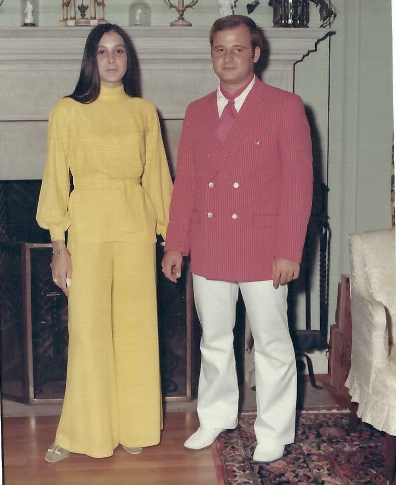 Judy and Vince standing together in formal clothes
