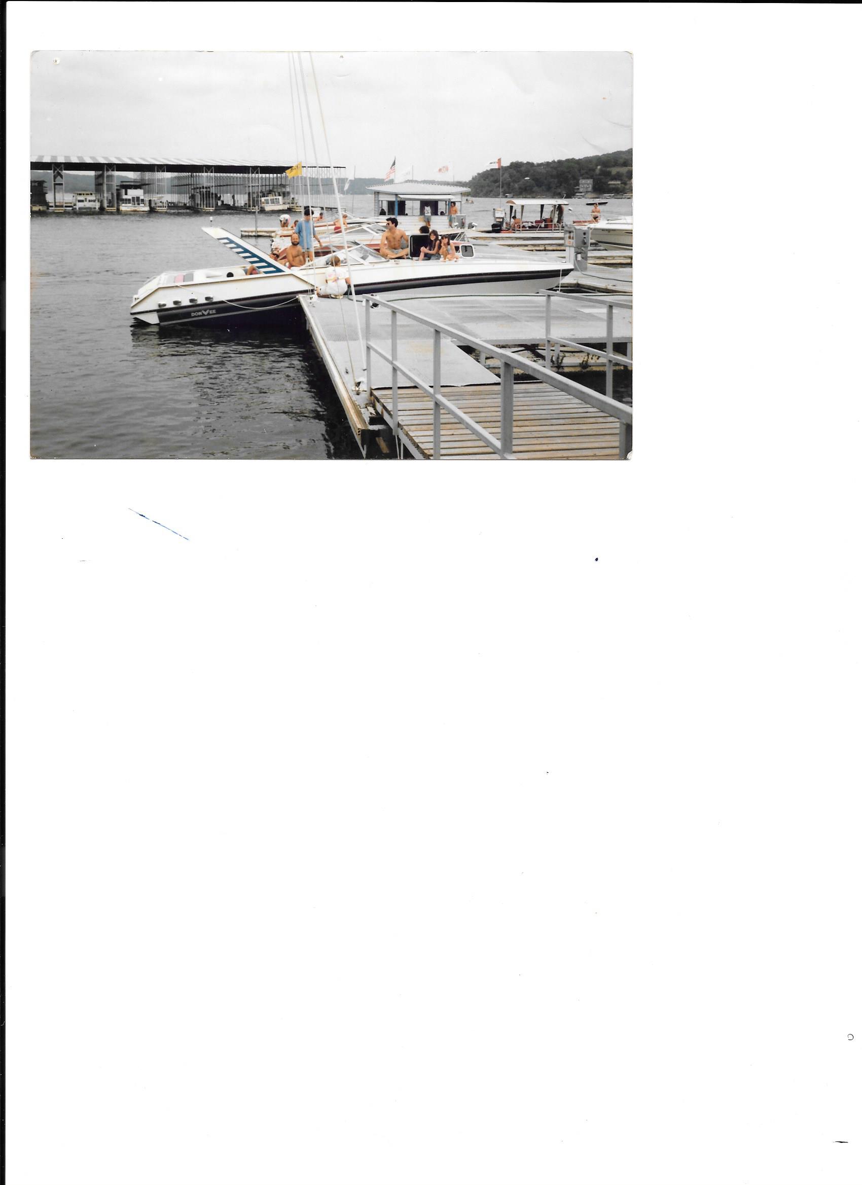 Family and friends gathered on a boat at a dock