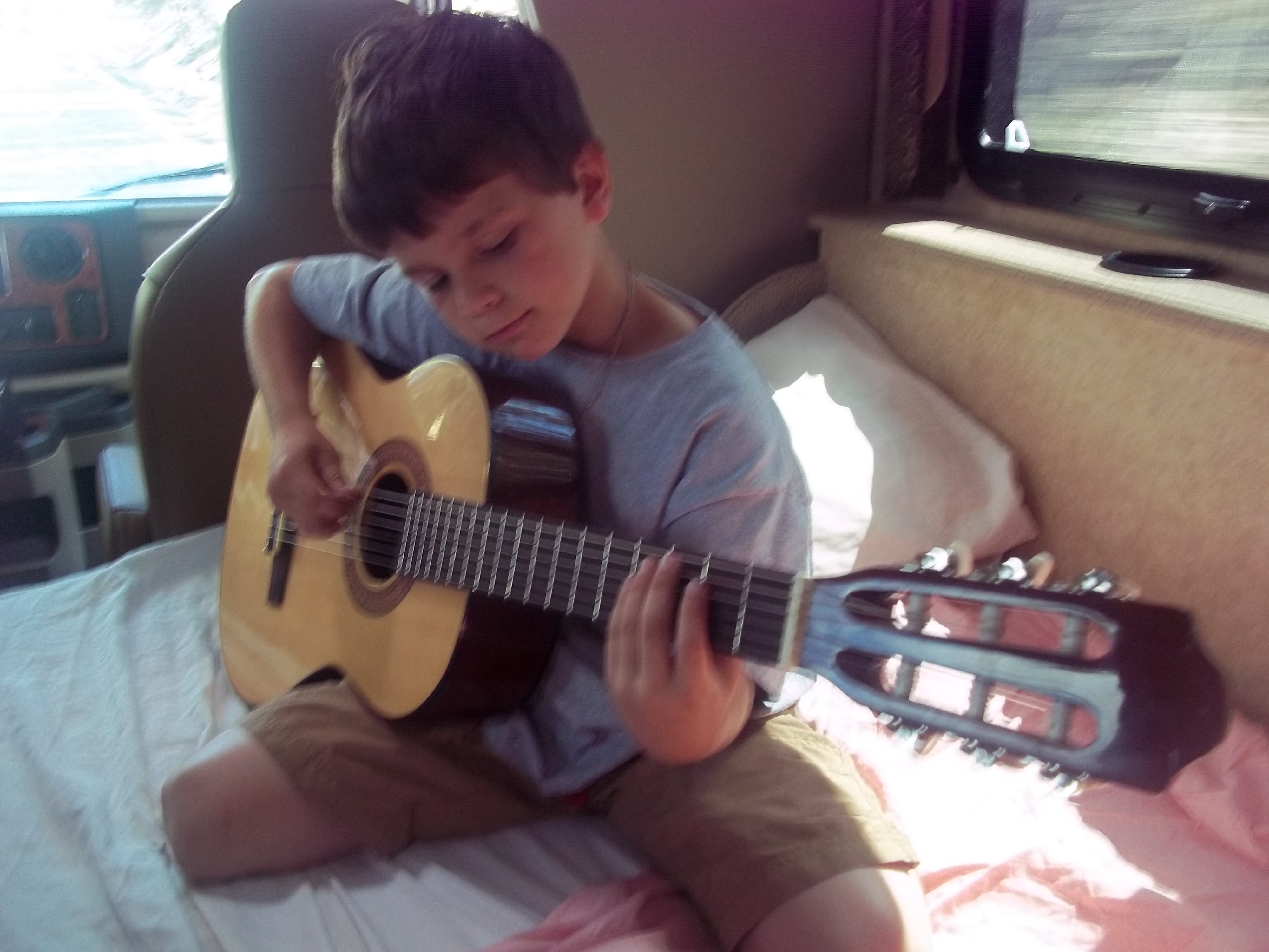 A boy playing guitar